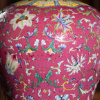 Famille rose floral enamel over the incised carmine ground