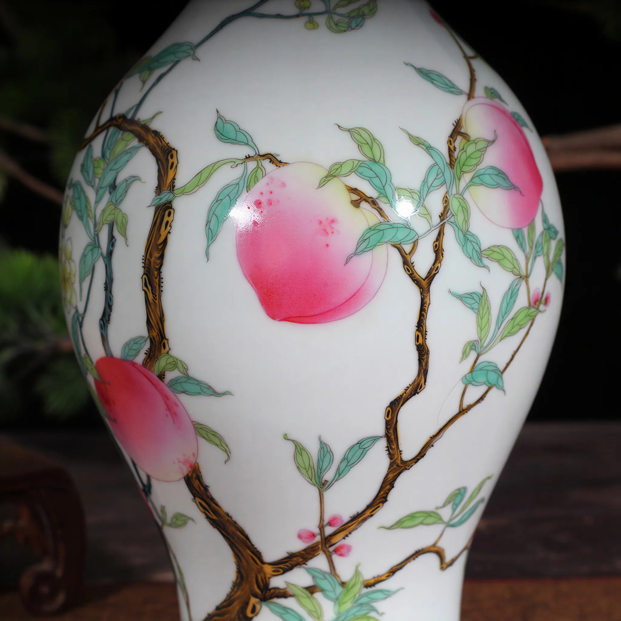 Peach branch, leaf, and blossom detail in famille rose enamels