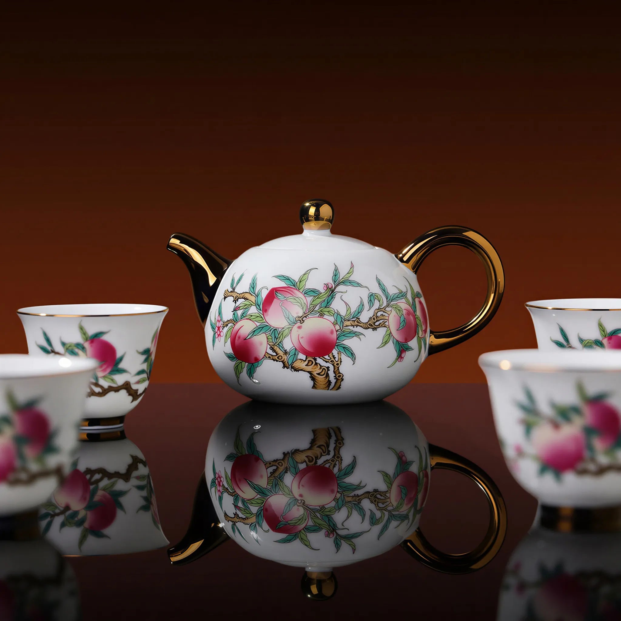 Gold-colored rim and spout details on the peach teapot