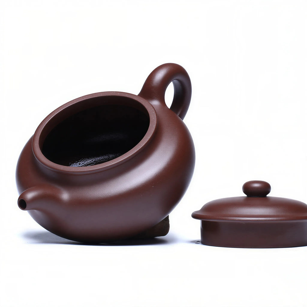 Fanggu teapot shown with lid and body separated