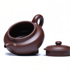 Fanggu teapot shown with lid and body separated