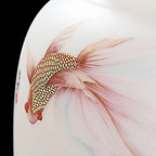 Close view of a long-finned goldfish with raised gold-toned scale details