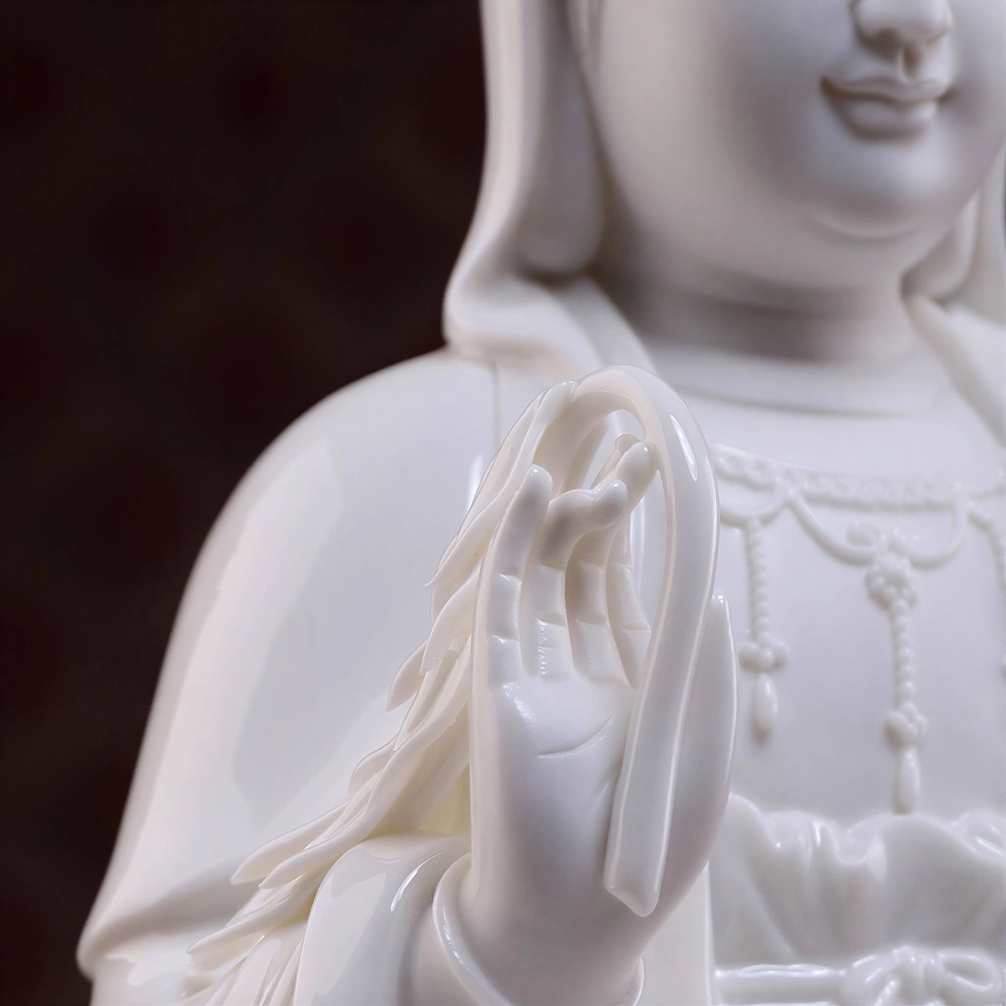Detail of the raised hand on the seated Guanyin
