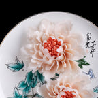 Close view of hand-modeled porcelain peony petals and coral center