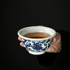 Hand-painted blue-and-white scrolling lotus master cup
