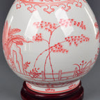 Close view of hand-painted bamboo within the underglaze-red garden scene