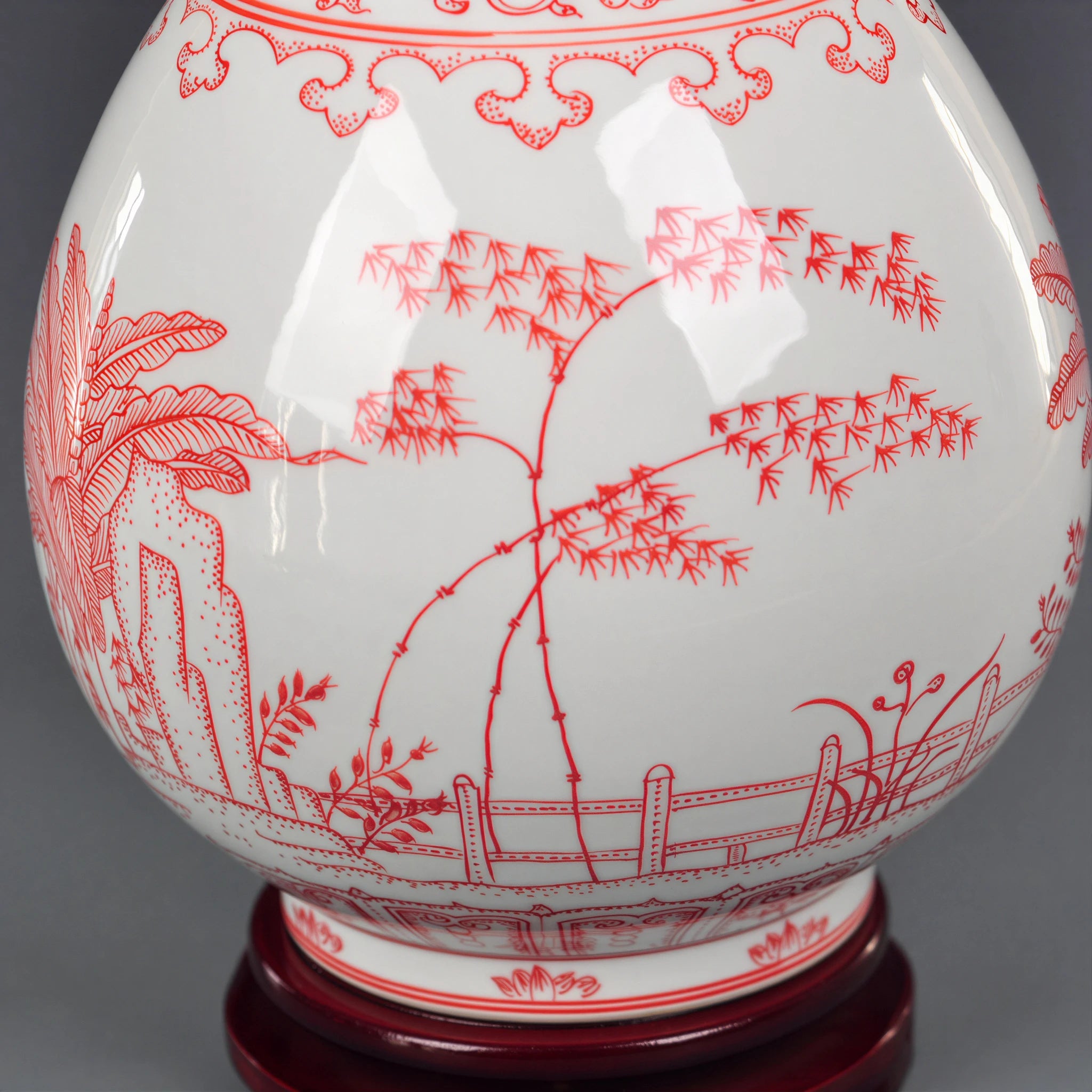 Close view of hand-painted bamboo within the underglaze-red garden scene
