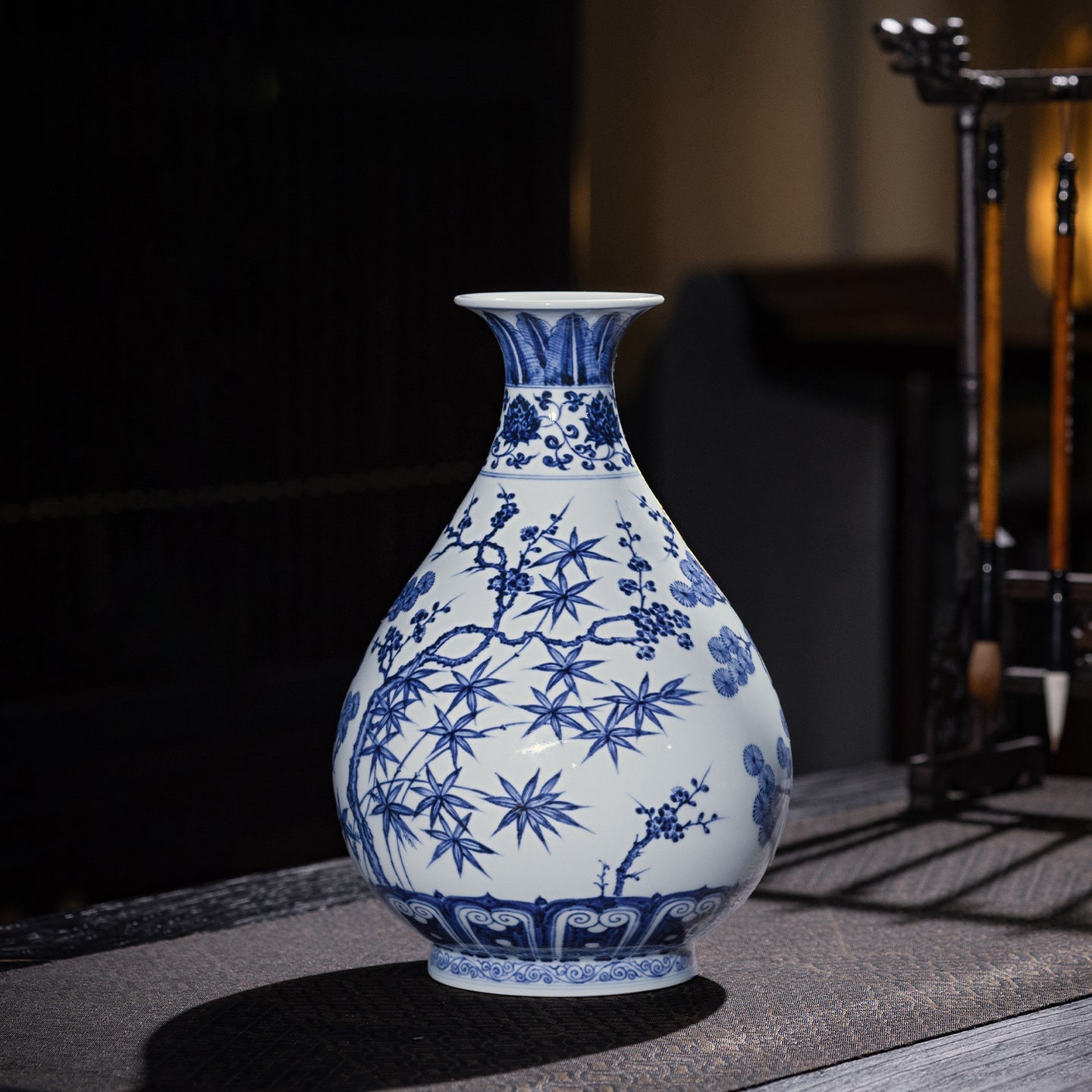 Front view of a Jingdezhen blue-and-white Yuhuchun vase with pine, bamboo and plum motif