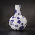 Front view of a Jingdezhen Tianqiu vase with cobalt floral medallions and white linglong windows