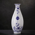 Front view of a Jingdezhen Guanyin vase with cobalt lotus scrolls and white linglong windows
