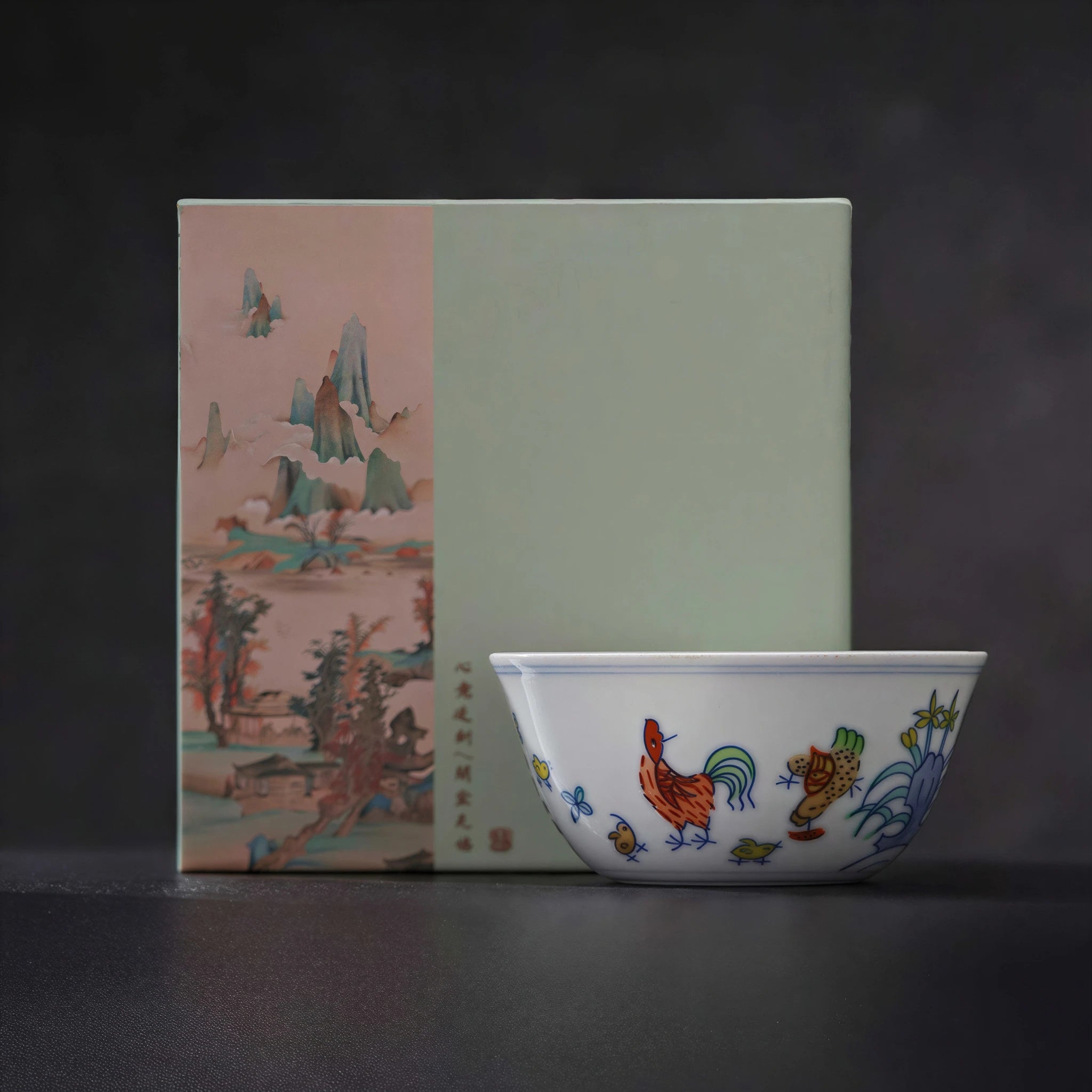 Jingdezhen doucai chicken cup displayed beside its presentation box