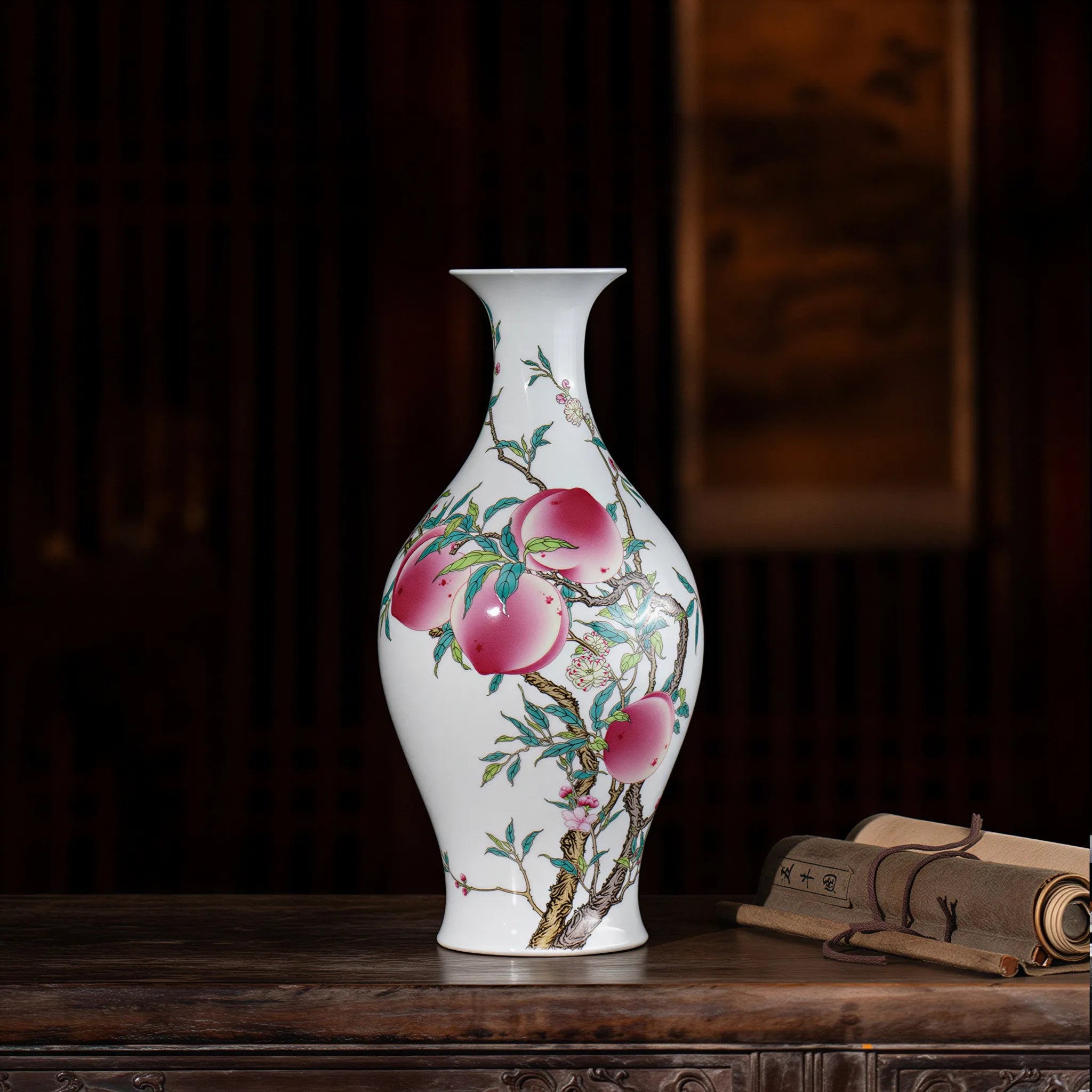 Front view of the Jingdezhen famille rose peach and bat olive vase