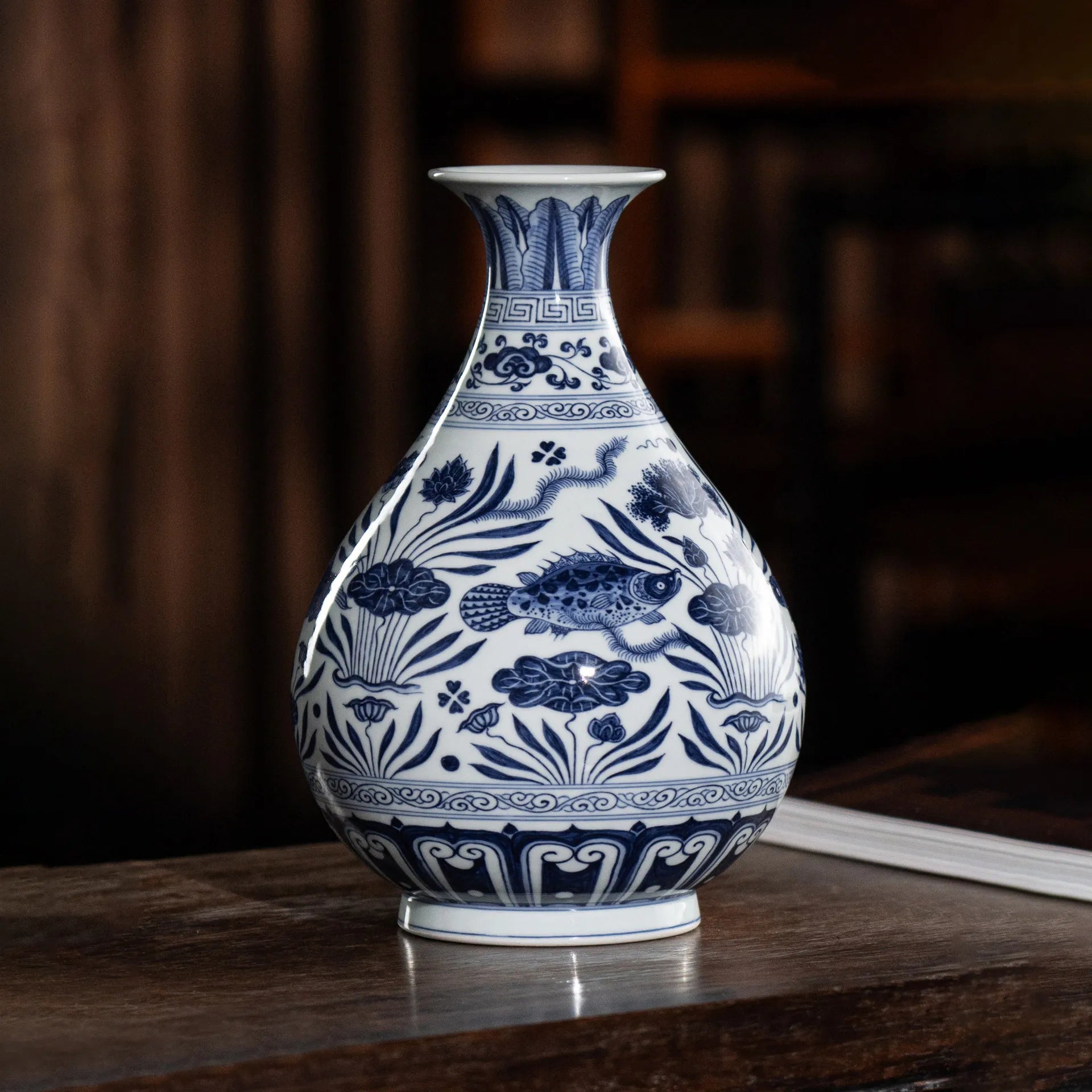 Blue-and-white fish Yuhuchun vase in studio light