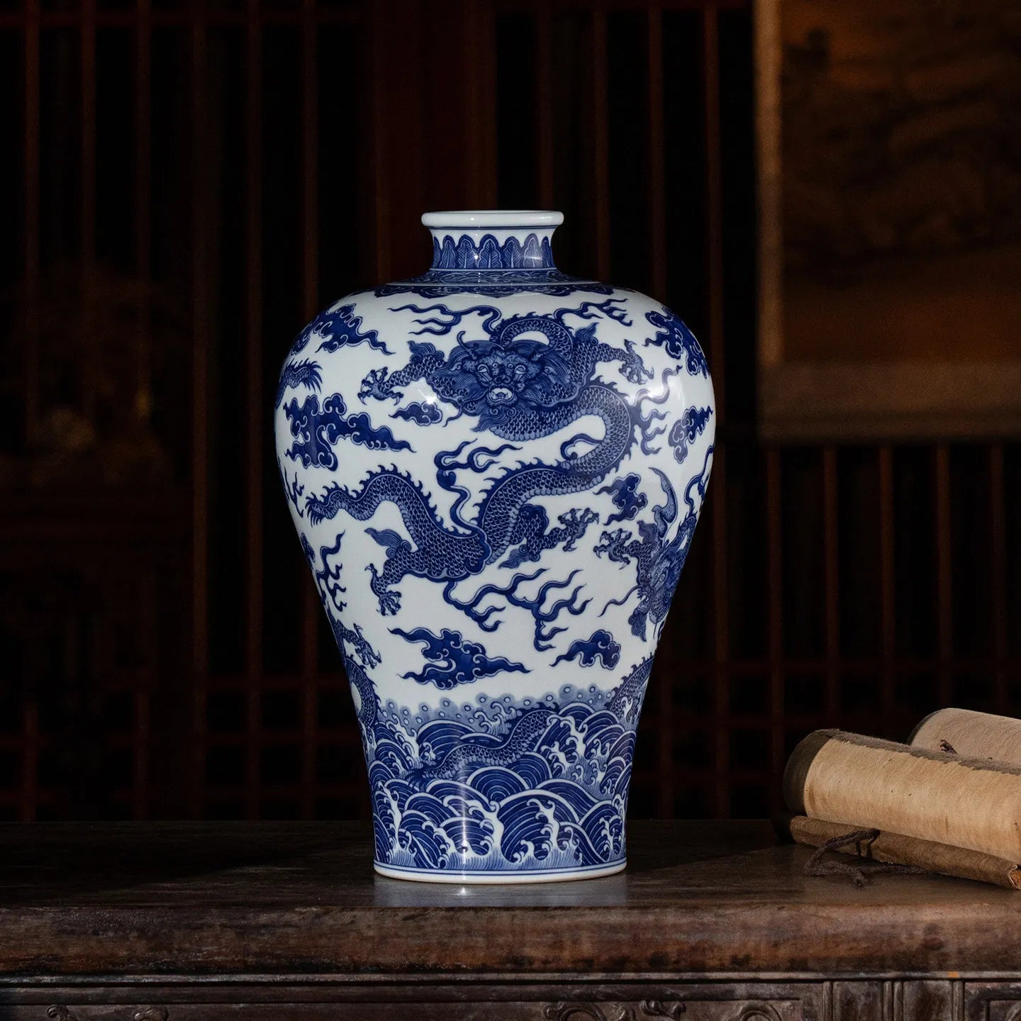 Five-dragon blue-and-white meiping displayed on a cabinet