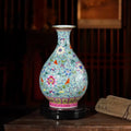 Green-ground famille rose Yuhuchun vase in an interior