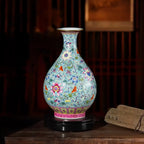 Green-ground famille rose Yuhuchun vase in an interior