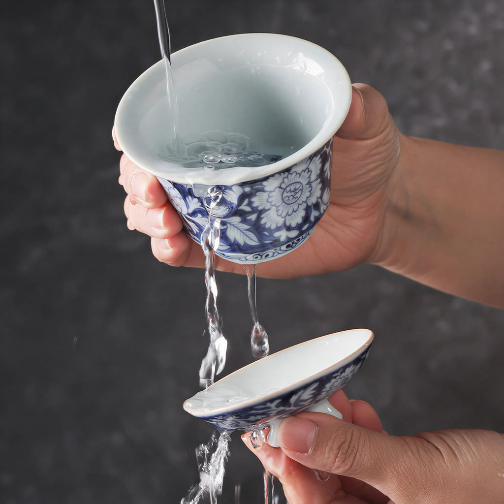 Water rinsing the Jingdezhen in-glaze peony gaiwan