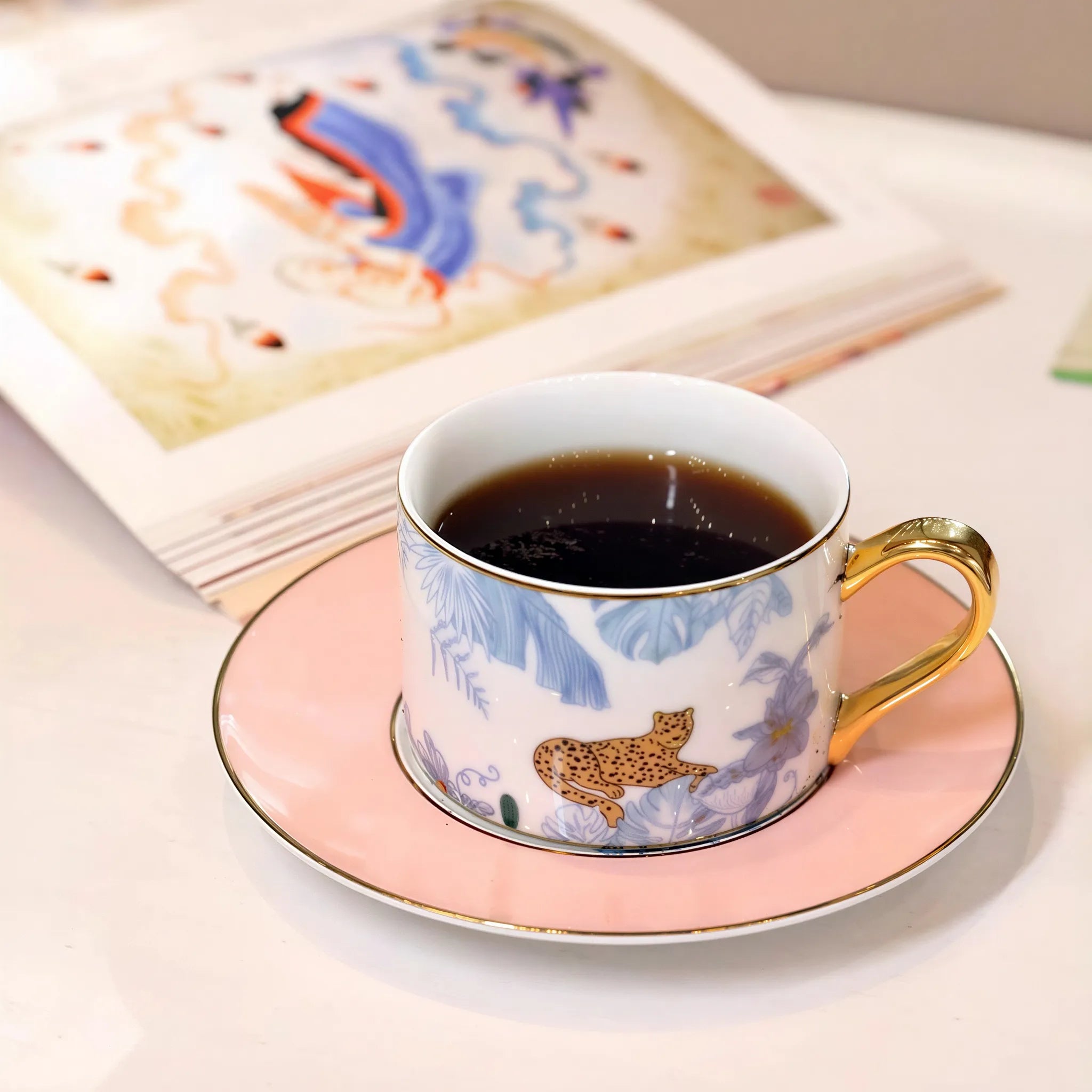 Leopard and foliage detail on the Jingdezhen porcelain coffee cup