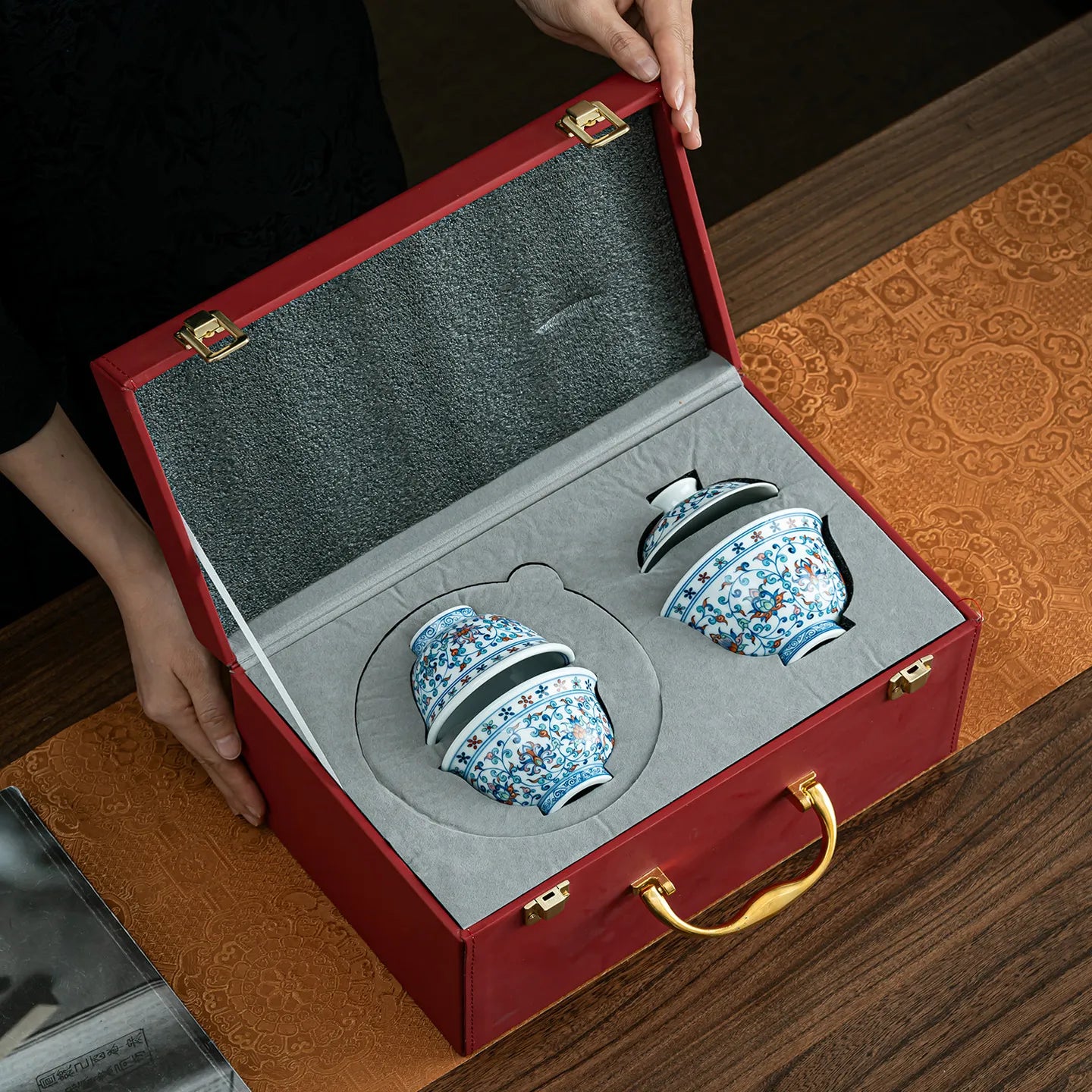Four-piece lotus tea set arranged in fitted gift packaging