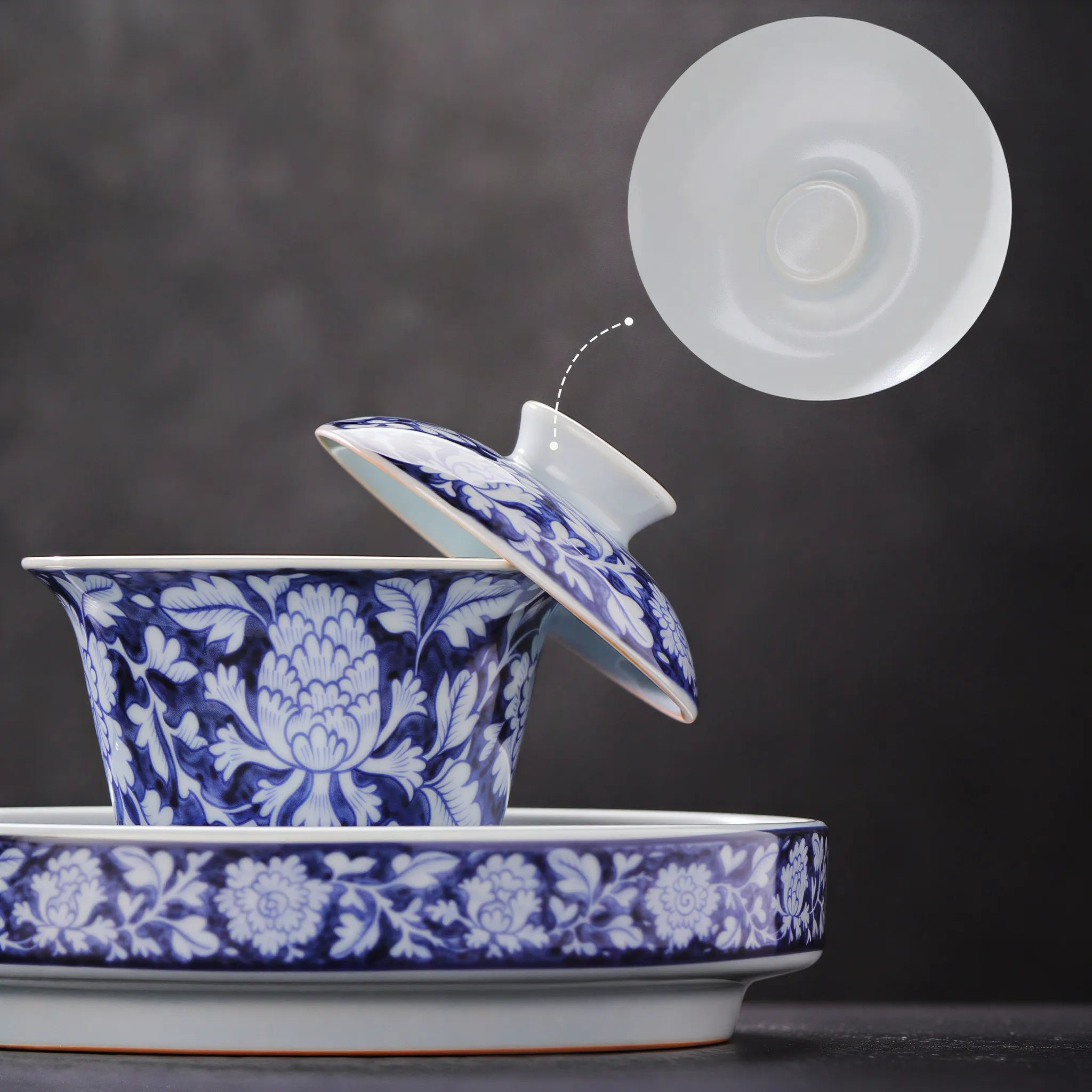 Lid fit and flared rim of the in-glaze peony gaiwan