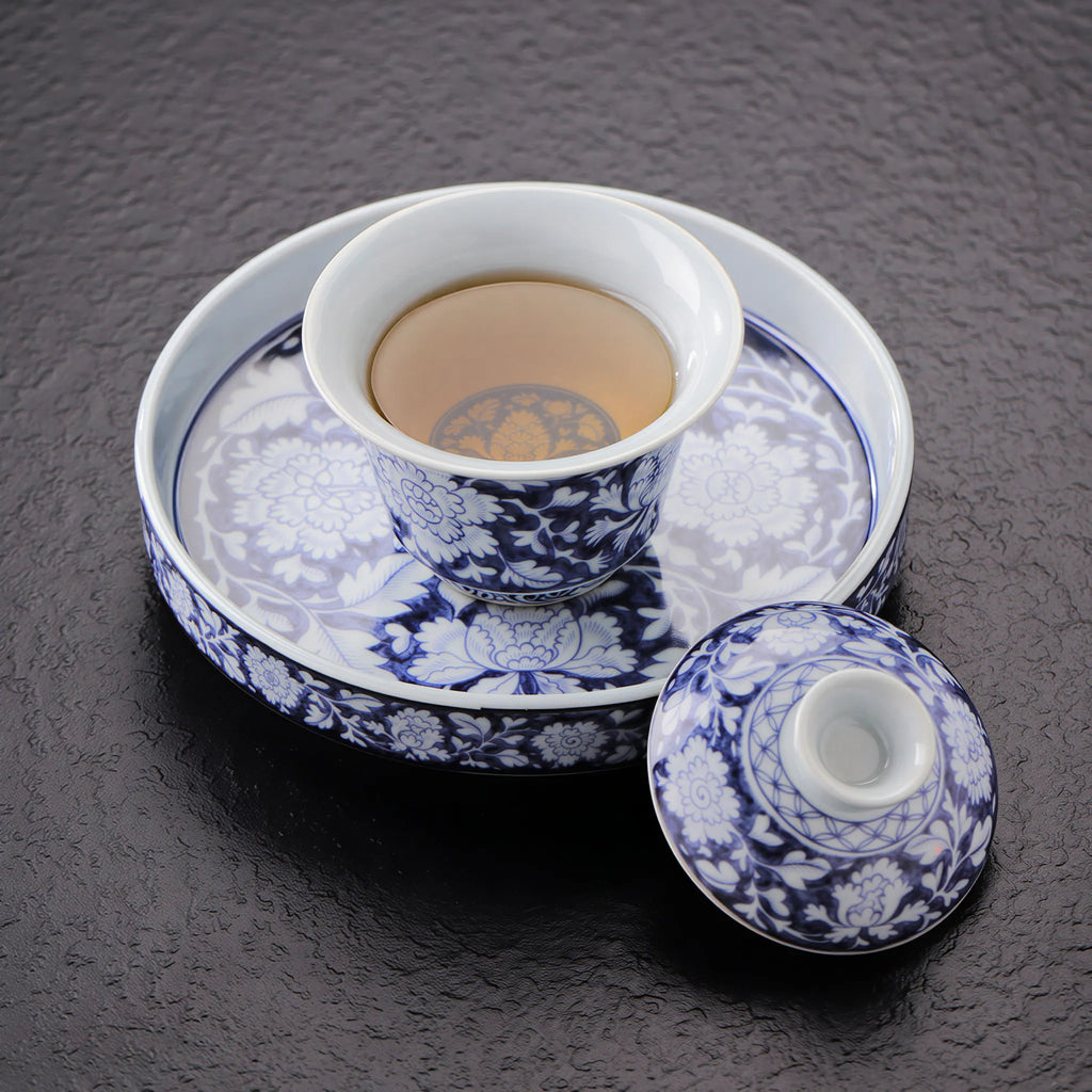 Peony gaiwan placed on the ceramic tea stage
