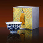 Blue-and-white press-hand cup with its presentation box