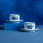 Two ribbon bird porcelain coffee cups with matching saucers
