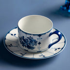 Jingdezhen ribbon bird porcelain coffee cup held in hand