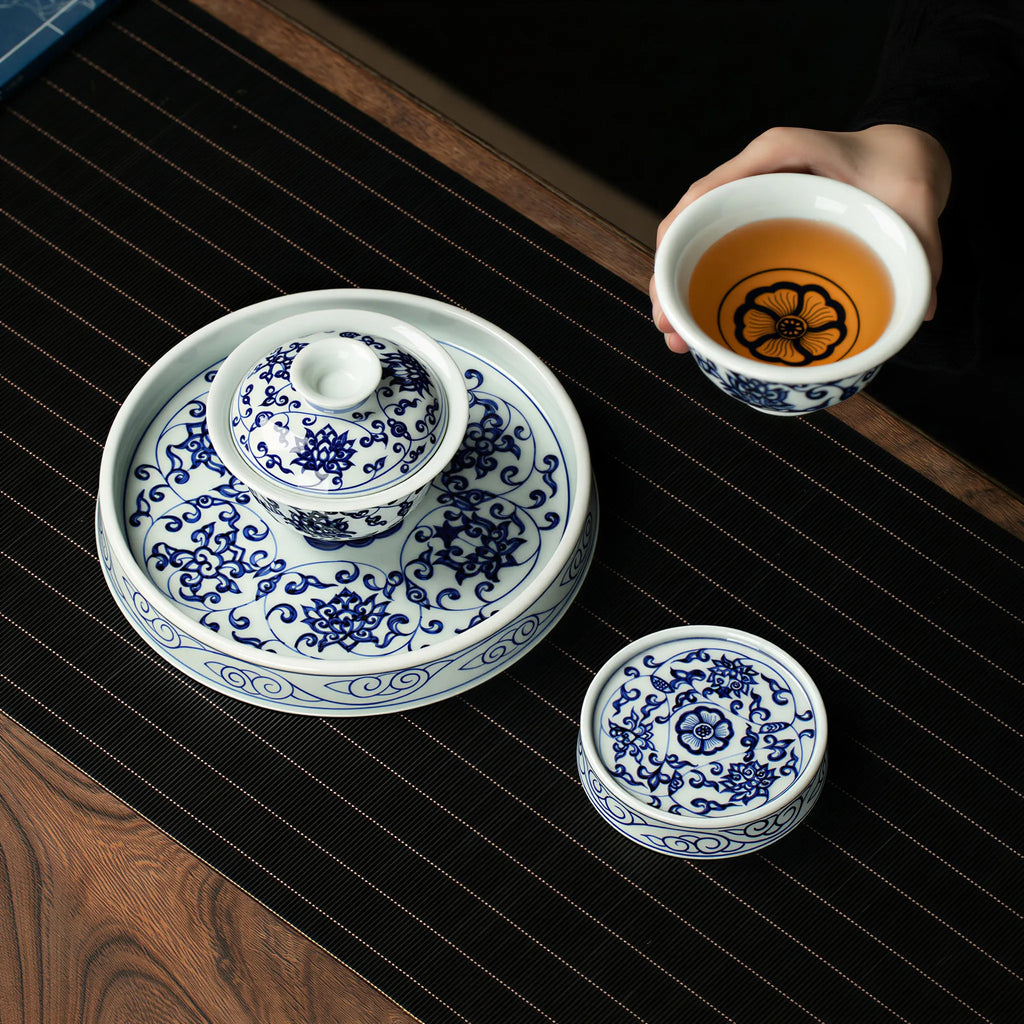 Overhead view of the gaiwan, cup, tea stage, and lid rest