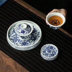 Overhead view of the gaiwan, cup, tea stage, and lid rest