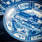 Close view of the central blue pictorial scene on the Jingdezhen Silk Road porcelain plate.