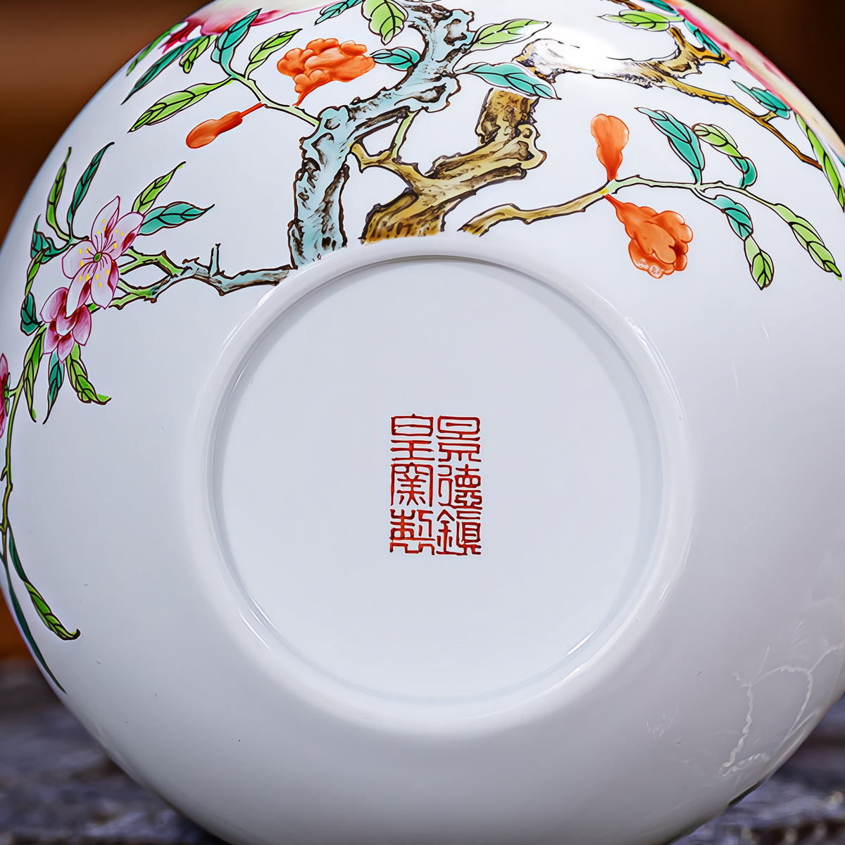 Underside of the porcelain Tianqiu vase showing its circular foot and red seal mark.