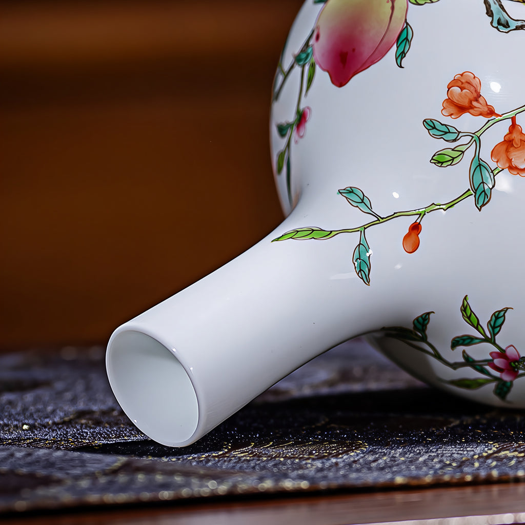 Close view of the white rim and slender neck of the Tianqiu vase, with painted leaves and orange flowers.