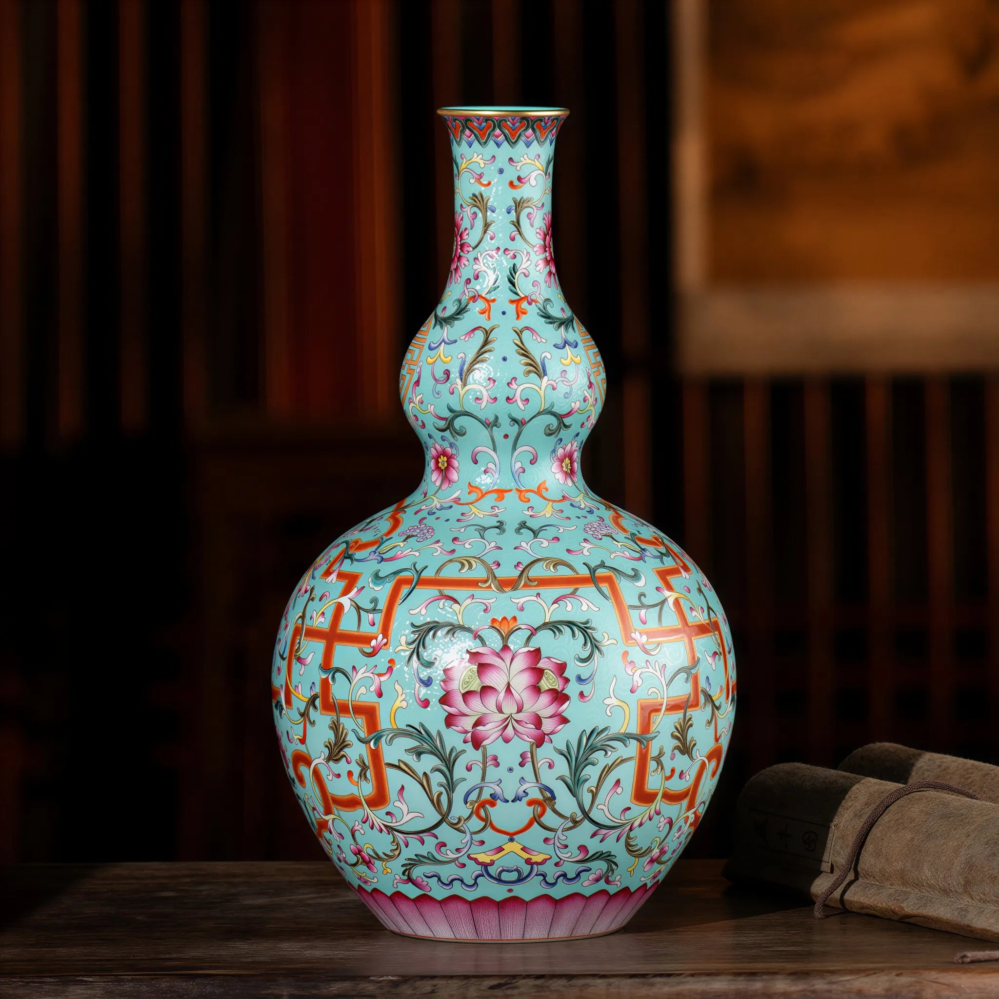 Turquoise-ground famille rose double-gourd vase in studio light