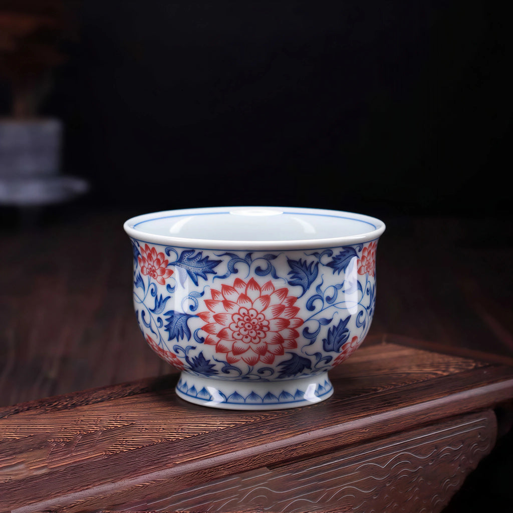 Wood-fired Jingdezhen teacup with underglaze red and blue lotus scrolls