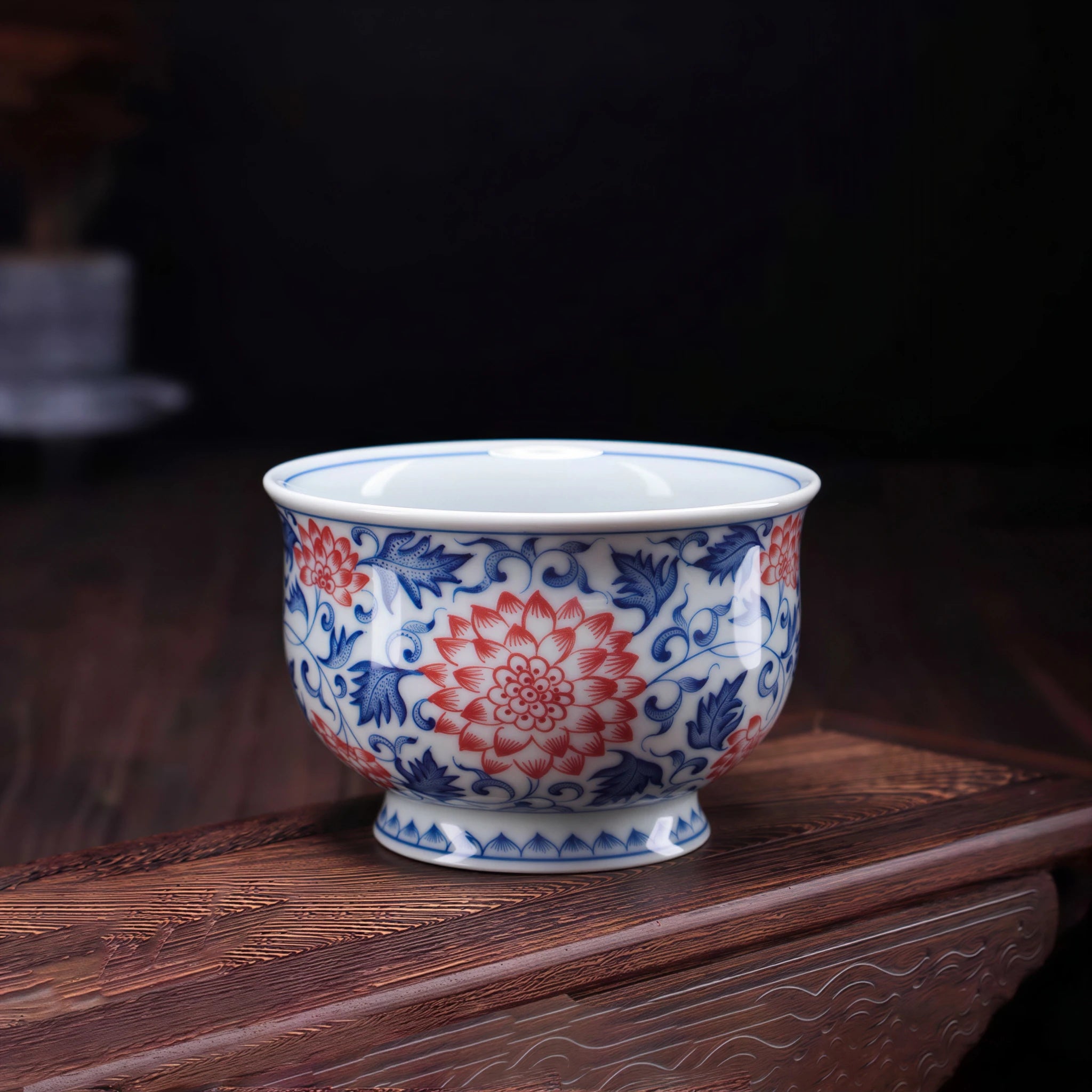 Wood-fired Jingdezhen teacup with underglaze red and blue lotus scrolls
