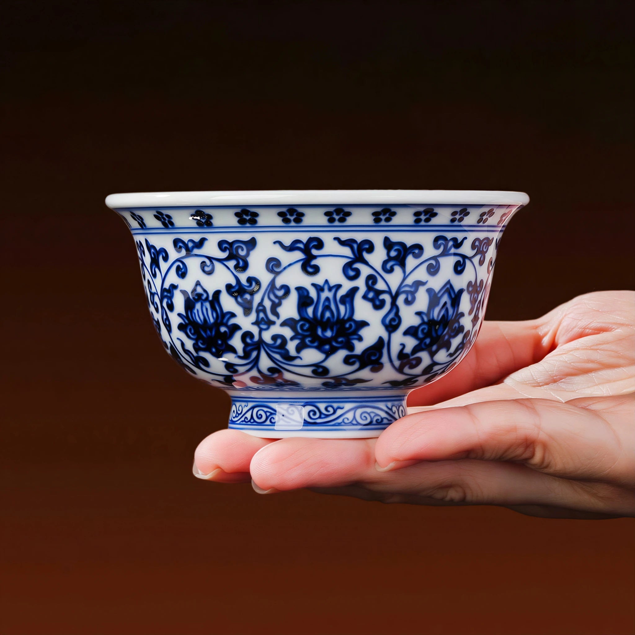 Jingdezhen press-hand cup resting securely in one hand
