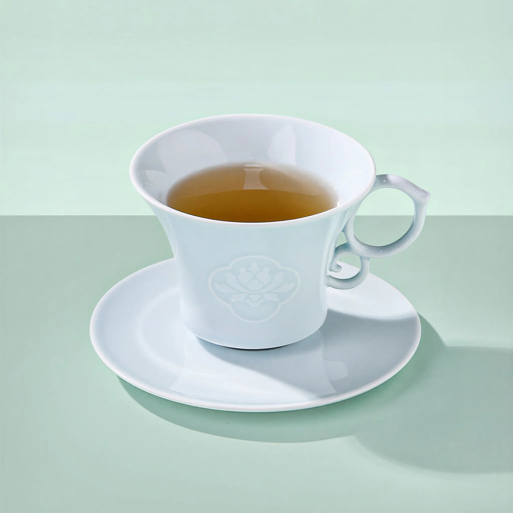 Jingdezhen Yingqing porcelain coffee cup with carved peony relief