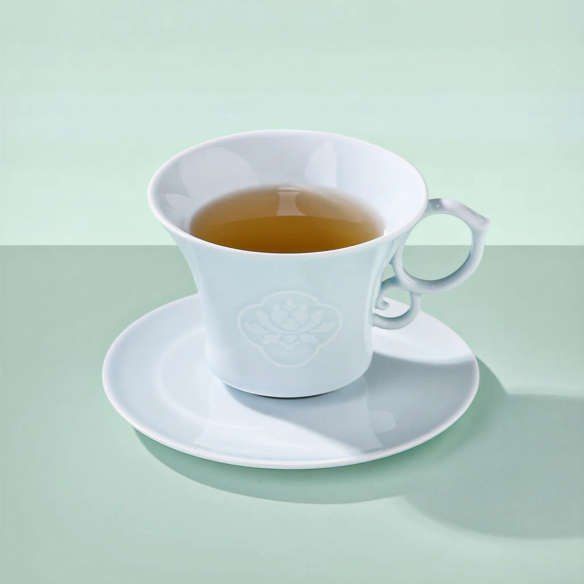 Jingdezhen Yingqing porcelain coffee cup with carved peony relief