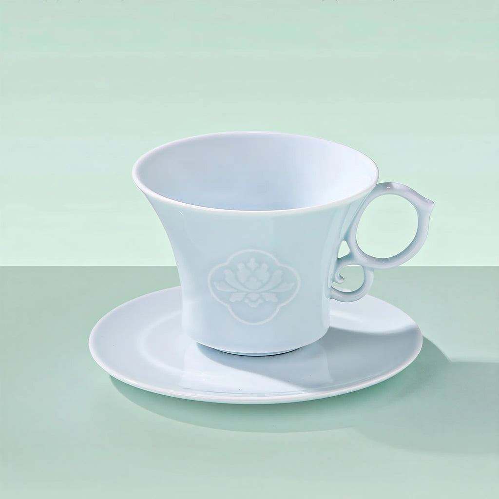 Yingqing carved peony coffee cup and matching saucer
