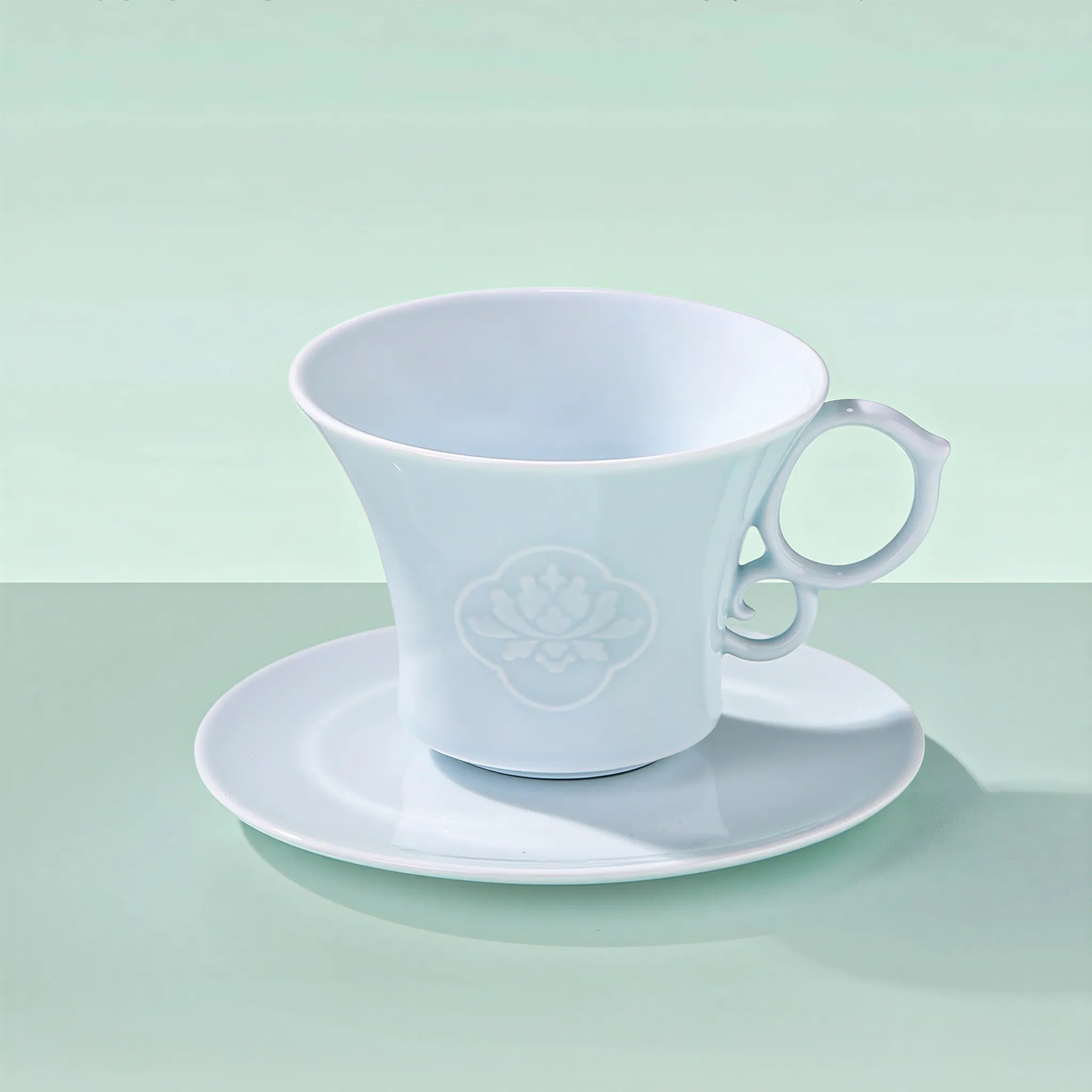 Yingqing carved peony coffee cup and matching saucer