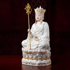 Gold-traced robes and ringed staff on the Ksitigarbha sculpture