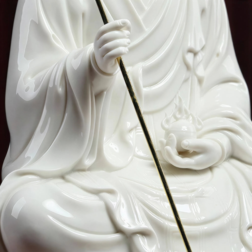 Detail of Ksitigarbha holding the gold-toned monk's staff