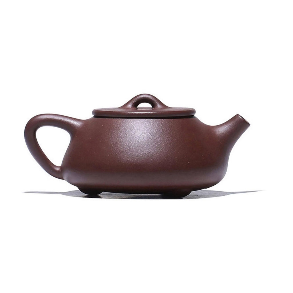 Angled profile of the carved landscape Shipiao teapot