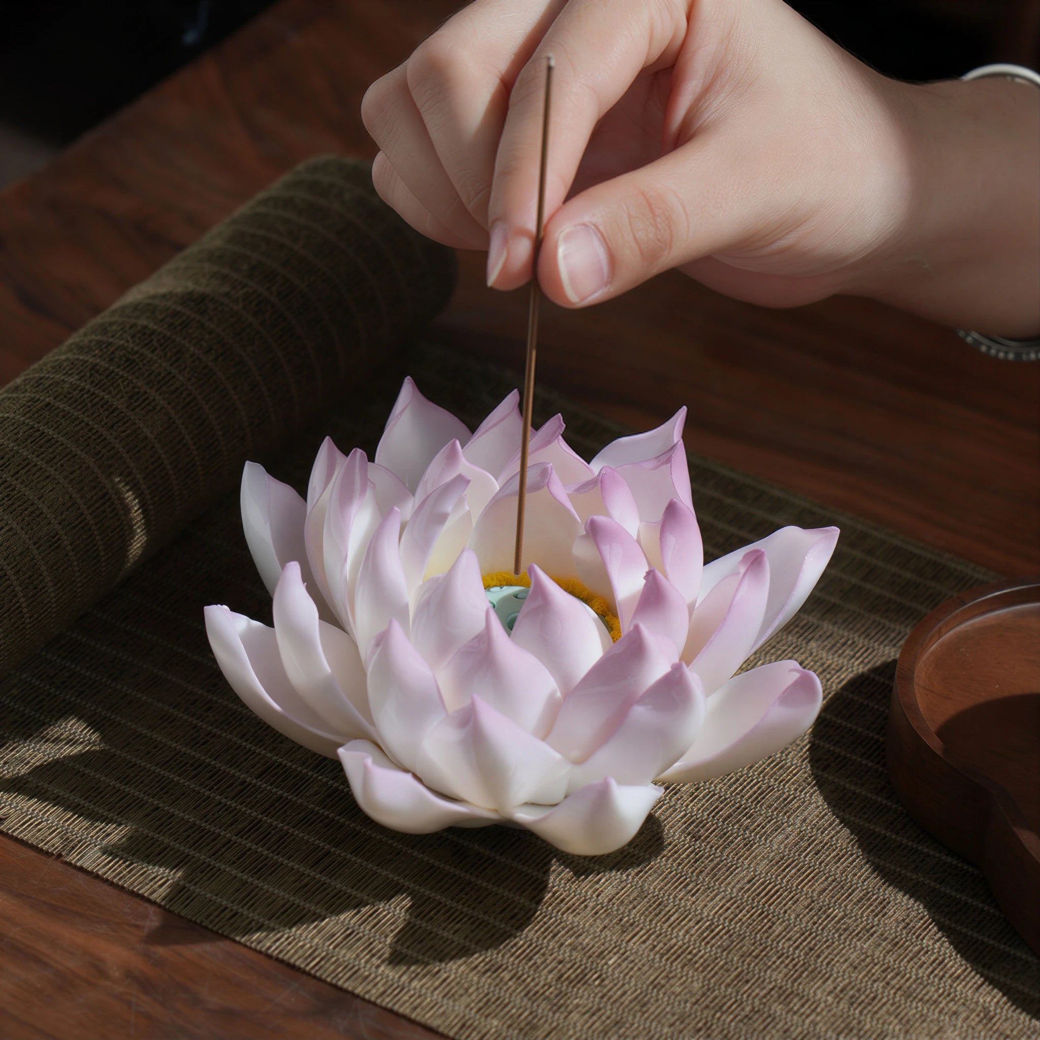 Lilac purple porcelain lotus incense holder being lit