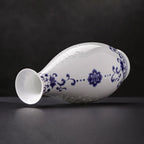 Guanyin vase resting horizontally to show its flared mouth and gently swelling profile