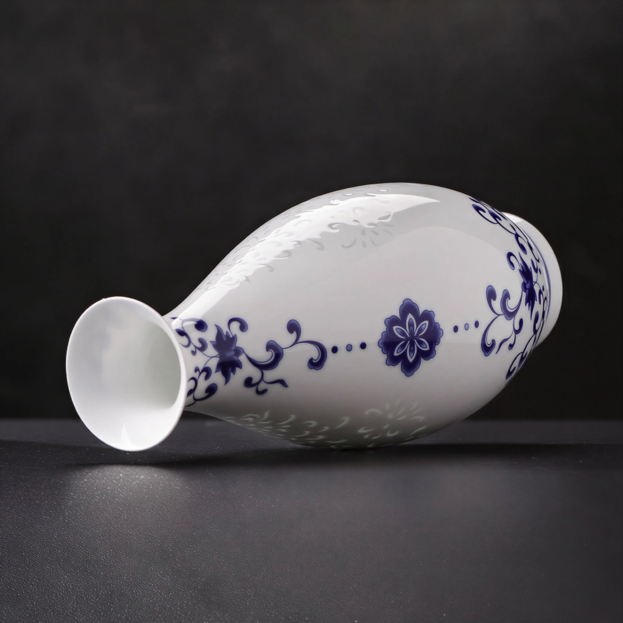 Guanyin vase resting horizontally to show its flared mouth and gently swelling profile