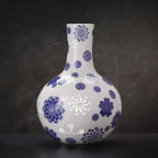 Full view of the cobalt floral Tianqiu vase with its globular body and upright neck