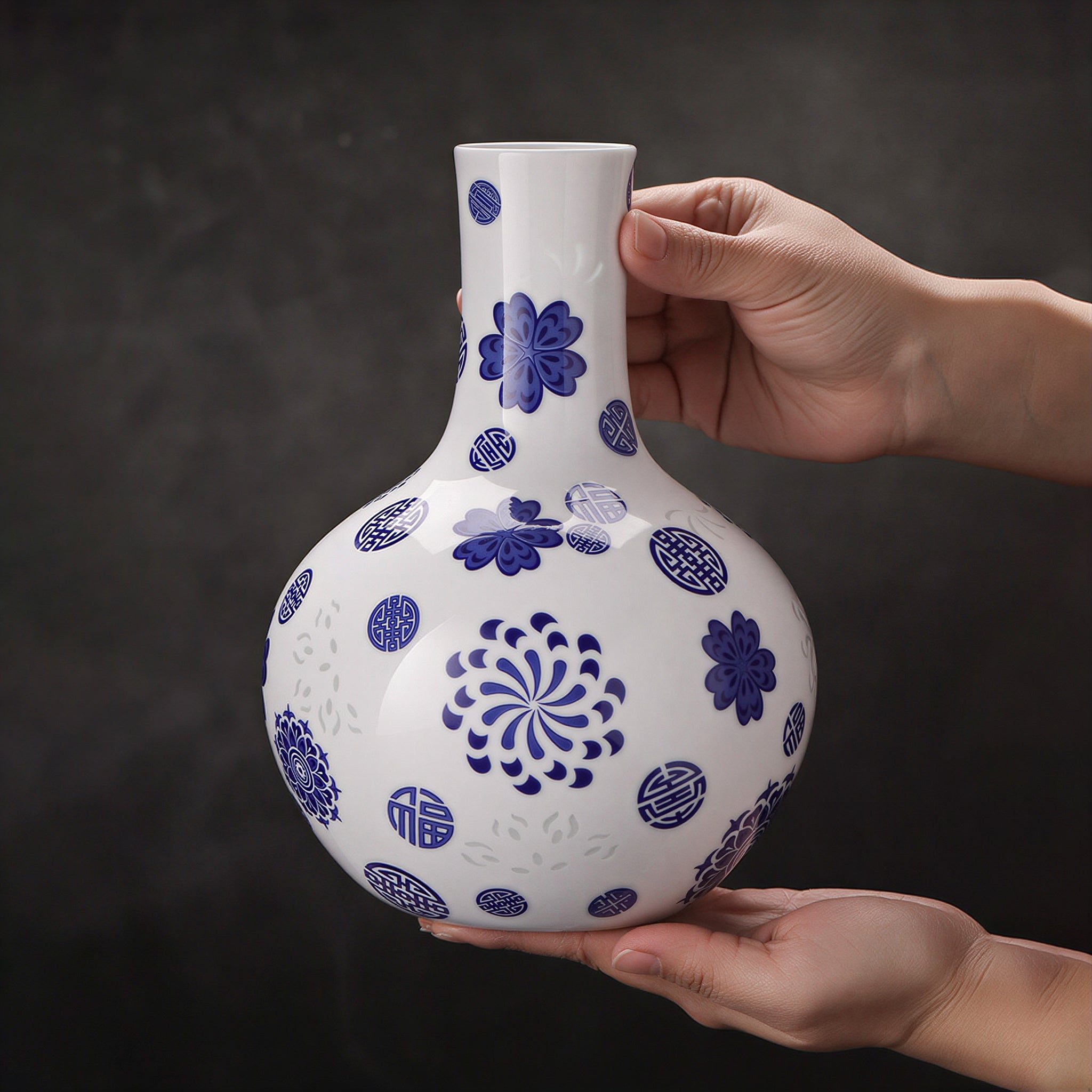 Jingdezhen linglong Tianqiu vase held between two hands to show its cabinet-scale proportions