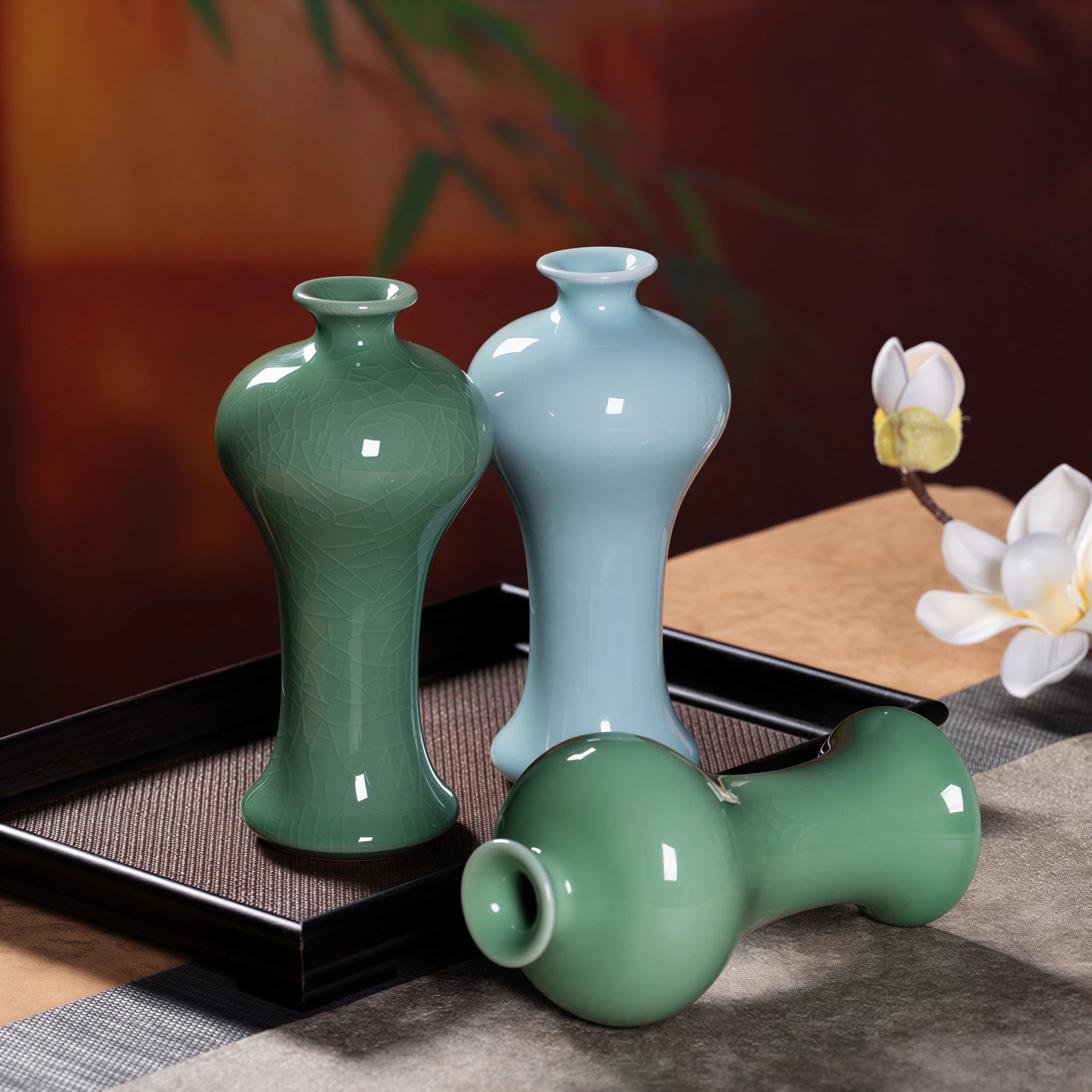 Crackle-glazed plum-green, powder-green, and plum-green vases together